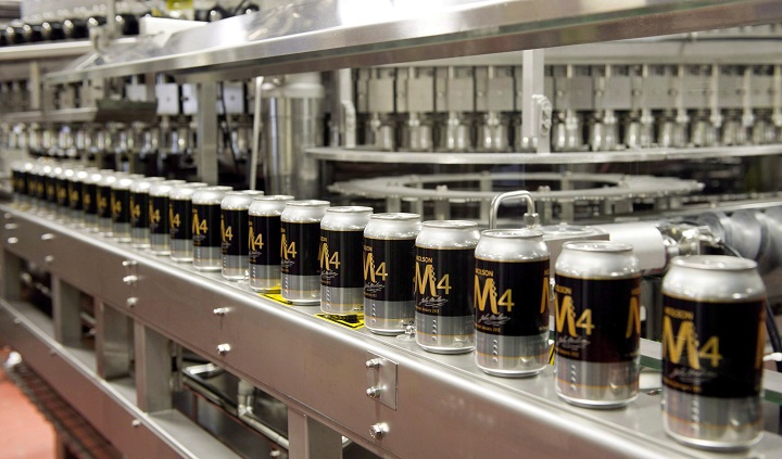 Cans of beer are seen on the new Molson Coors can line during its inauguration Monday, March 19, 2012 in Montreal.  