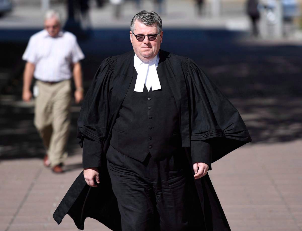 Crown Attorney Jeffery Richardson walks towards the Ottawa Courthouse following jury selection for the trial of Basil Borutski on three counts of first-degree murder, in Ottawa on Tuesday, Oct. 3, 2017. Borutski is accused of killing Anastasia Kuzyk, 36, Nathalie Warmerdam, 48, and Carol Culleton, 66, in Renfrew County, near Wilno, Ont., on Sept. 22, 2015.