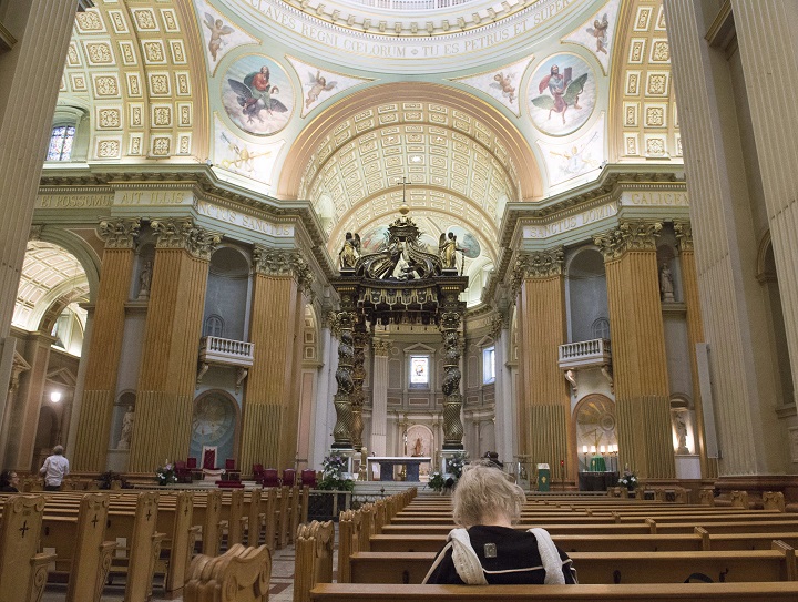 Worshippers pray at Marie Queen of the world cathedral, Thursday, June 23, 2016 in Montreal. The Catholic Church of .