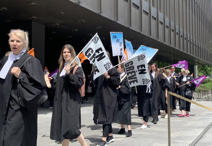 Legal aid lawyers hold a half-day strike as their contract negotiations are in a stalemate, in Montreal on Tuesday May 24, 2022. They resumed striking on Monday, June 6, 2022 over equal pay with Crown attorneys.