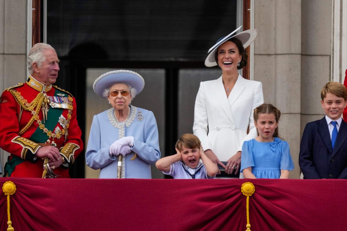 Prince Charles, from left, Queen Elizabeth II, Prince Louis, Kate, Duchess of Cambridge, Princess Charlotte, and Prince George on the balcony of Buckingham Palace, London, Thursday June 2, 2022, on the first of four days of celebrations to mark the Platinum Jubilee.