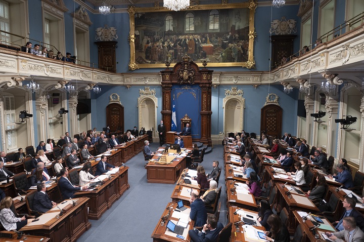 Quebec Premier François Legault, left, responds to the Opposition during question period, Wednesday, June 8, 2022 at the legislature in Quebec City.