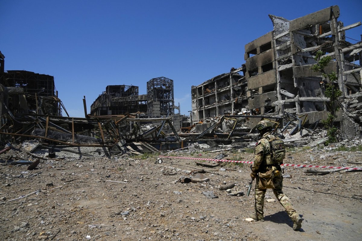 A Russian soldier walks in front of the damaged Metallurgical Combine Azovstal plant, in Mariupol, on the territory which is under the Government of the Donetsk People’s Republic control, eastern Ukraine, Monday, June 13, 2022. The plant was almost completely destroyed during the siege of Mariupol. This photo was taken during a trip organized by the Russian Ministry of Defense. (AP Photo)