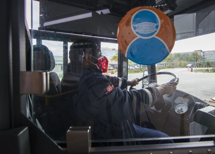 A TTC bus driver wearing a face mask is seen on a bus in Toronto, Canada, on Sept. 17, 2020. The TTC's masking requirement will be lifting Saturday for its conventional system.