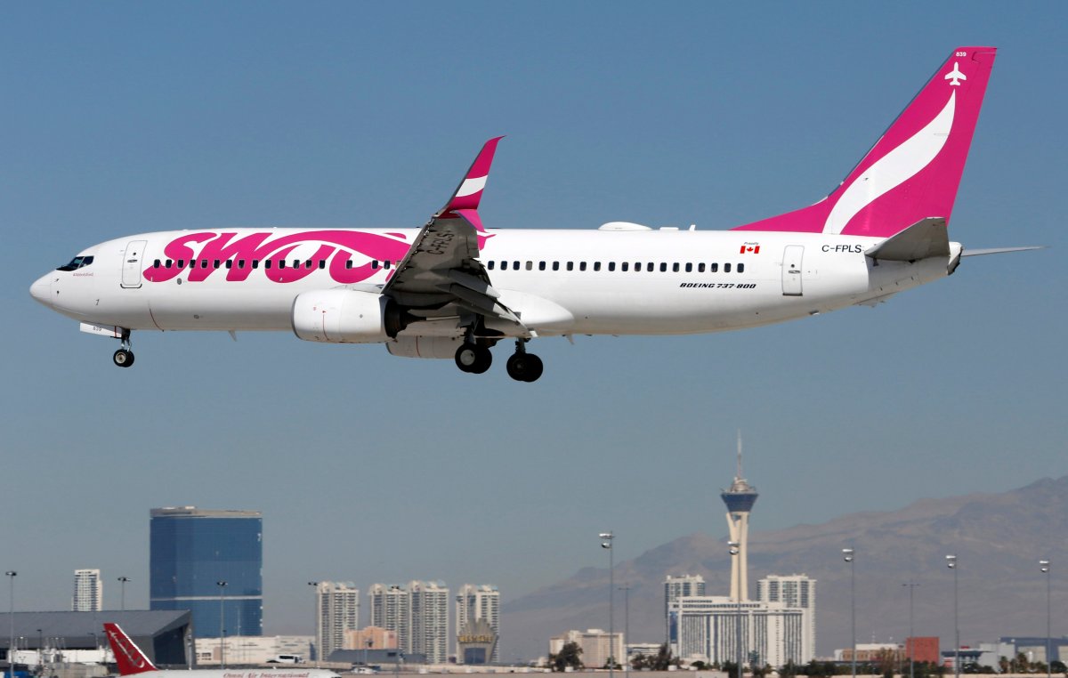 A Boeing 737 (737-800) jetliner, belonging to WestJet Airlines low-cost carrier Swoop, lands at McCarran International Airport in Las Vegas, on Feb. 27, 2020.