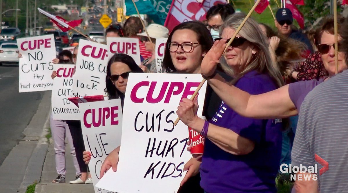 Members of CUPE Local 1423 protest near the school board office.