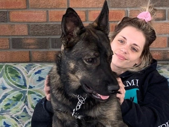 A photo of Chelsea Cardno and her dog, JJ.