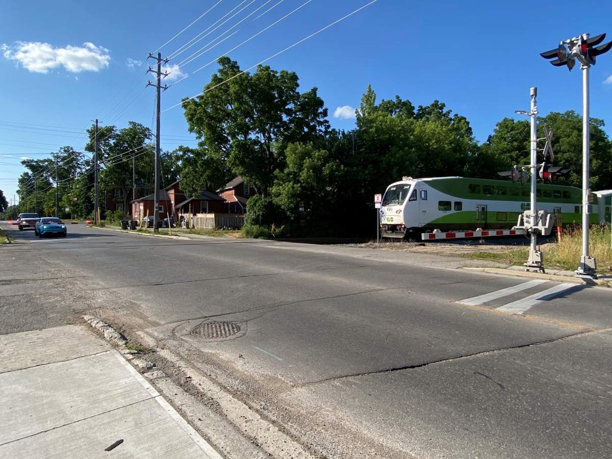 GO Train about to cross Edinburgh Road in Guelph.