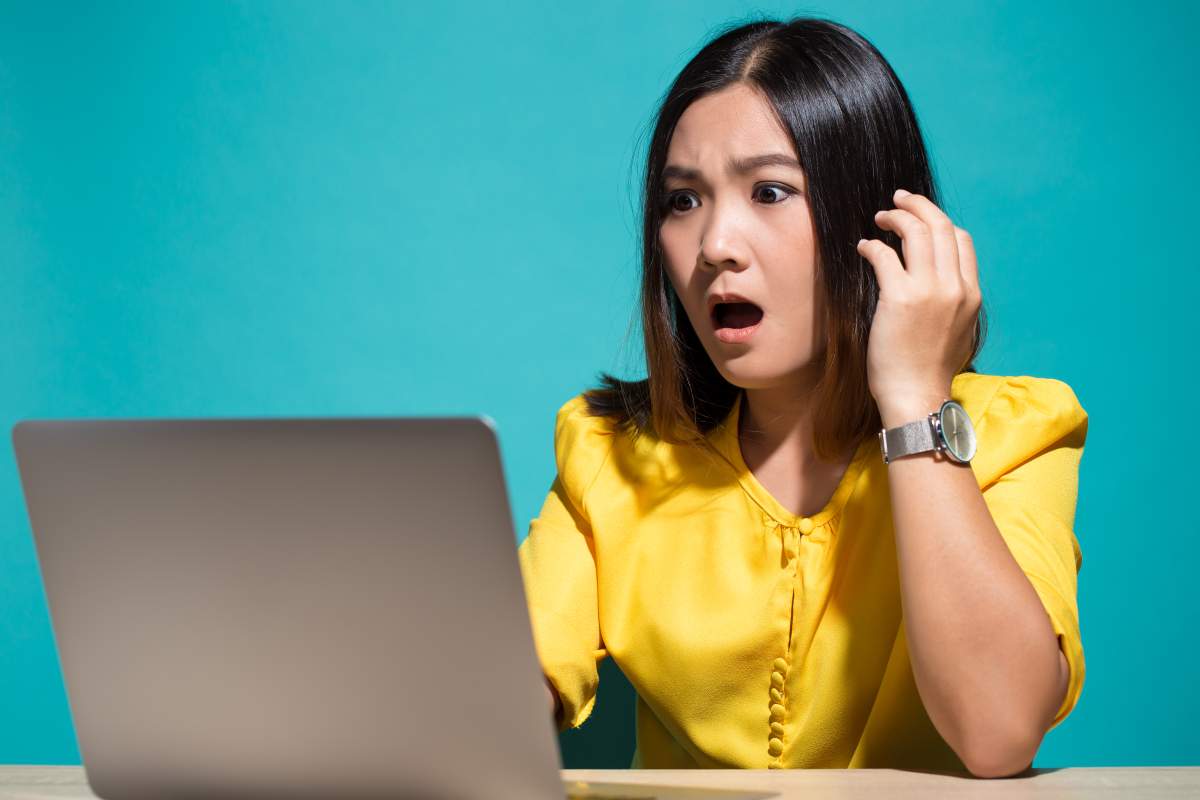 Woman has shock when she look at laptop