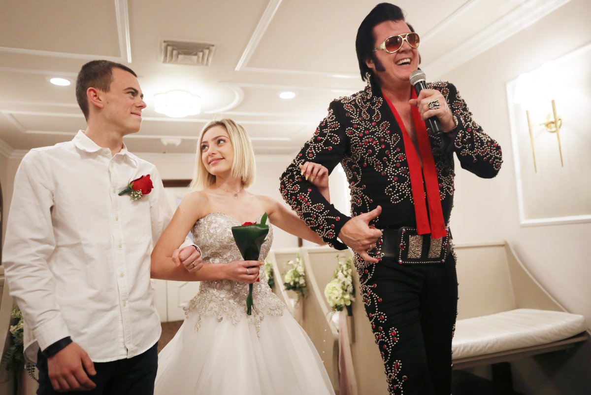 Elvis impersonator and owner Brendan Paul sings during a 'commitment ceremony' for a couple from France at the Graceland Wedding Chapel on February 20, 2020 in Las Vegas, Nevada. Paul said he performs 5,000-6,000 wedding ceremonies each year at the chapel.