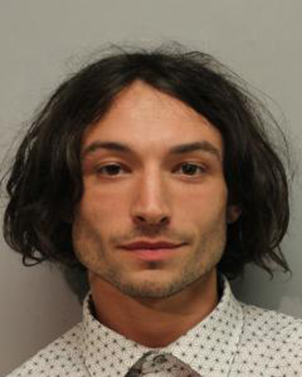 In this handout image provided by Hawaiʻi Police Department, Ezra Miller is seen in a police booking photo after his arrest for disorderly conduct and harassment on March 28, 2022 in Hilo, Hawaii.