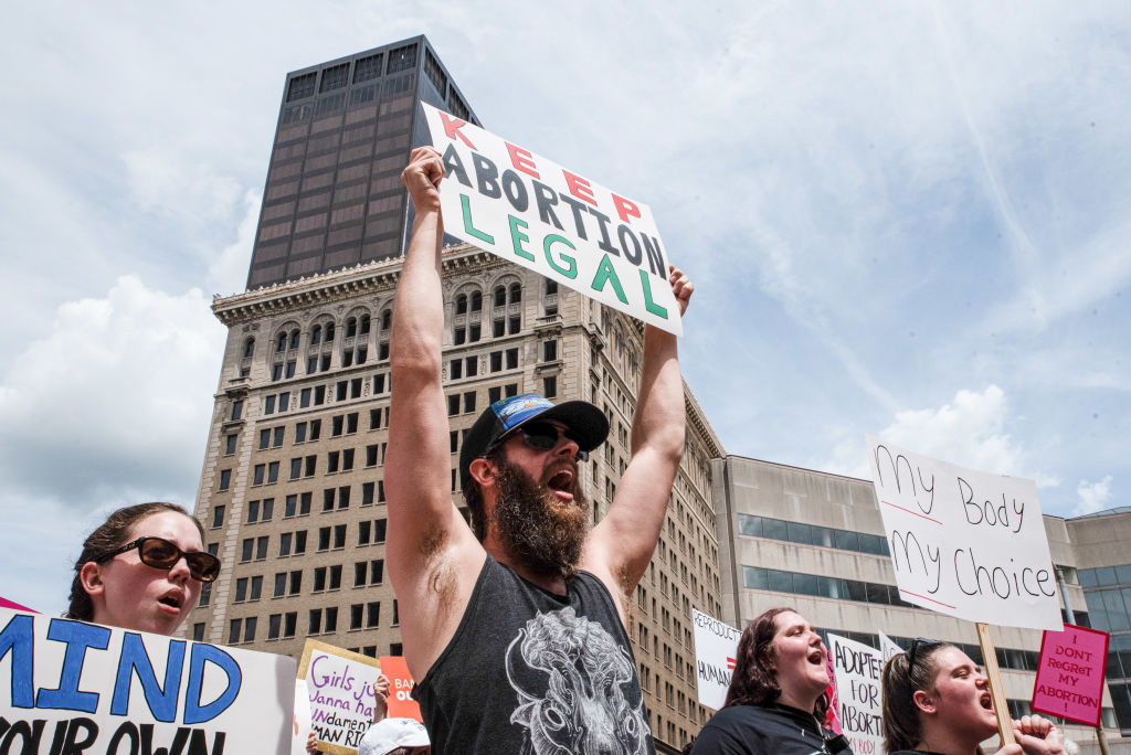 Protesters hold placards expressing their support for abortion rights at a rally in Dayton, Ohio.