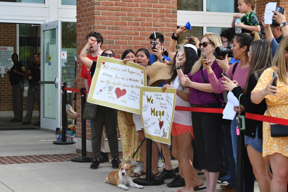 Fans gather outside the Fairfax County Circuit Courthouse in Fairfax, Virginia, on June 1, 2022, after a verdict was reached in the Depp v. Heard defamation trial.