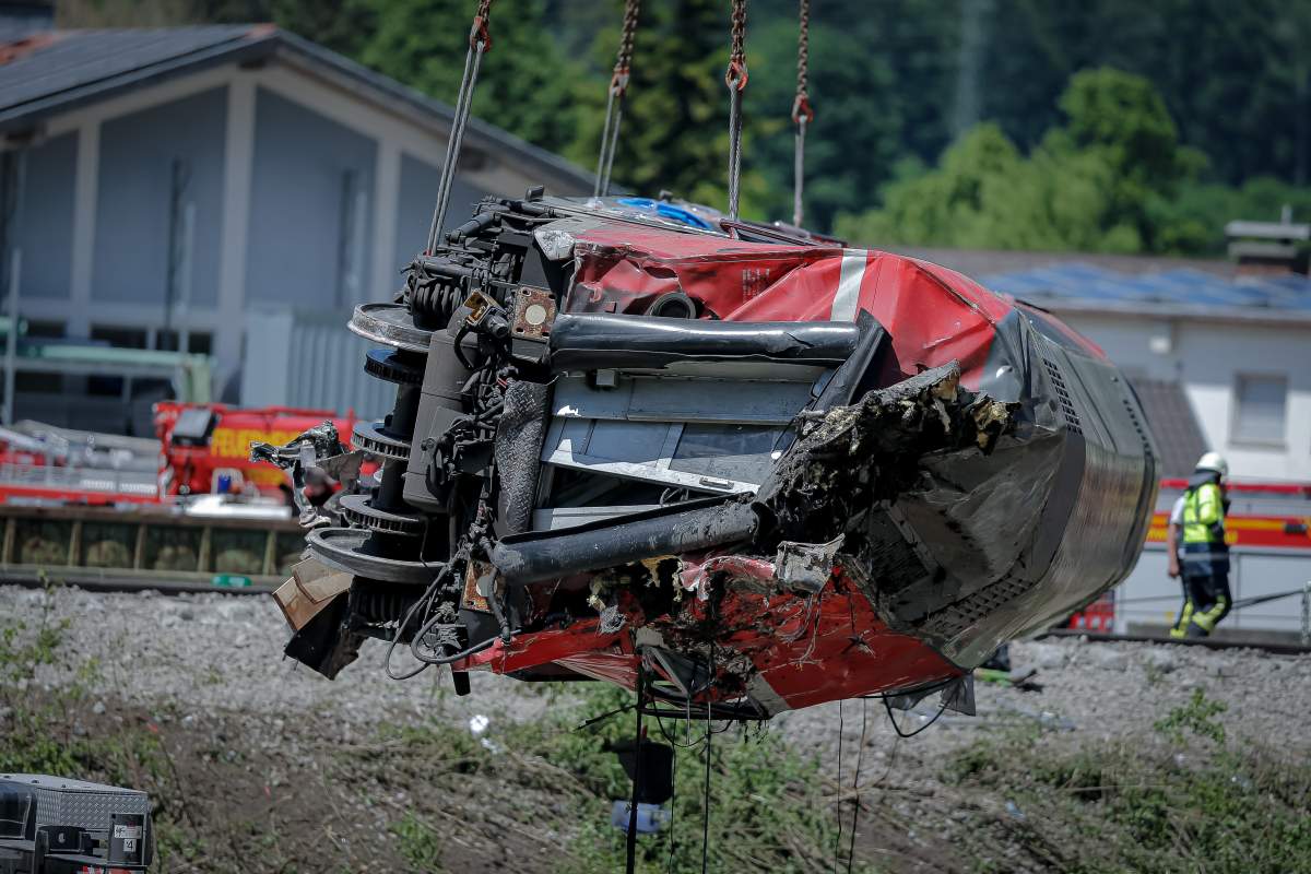A derailed train is being lifted from the tracks on June 4, 2022 near Garmisch-Partenkirchen, Germany. Rescuers are still looking for missing passengers following yesterday’s accident that left at least five dead and 40 injured. The train was on its way from Garmisch to Munich and included children heading out on holiday for the long Pentecost weekend.