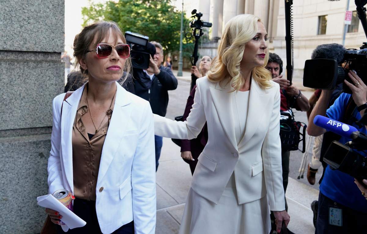 Victim Annie Farmer (L) and her lawyer Sigrid McCawley arrive at US District Court for the Southern District of New York on June 28, 2022, for the sentencing hearing of Ghislaine Maxwell.