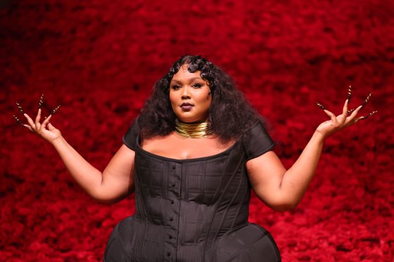 Lizzo, wearing a black dress and gold necklace, attends The 2022 Met Gala Celebrating "In America: An Anthology of Fashion" at The Metropolitan Museum of Art on May 02, 2022 in New York City.