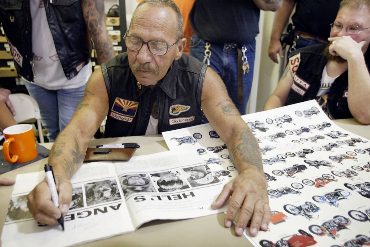 Sonny Barger, founder of the Oakland, California charter of the Hells Angels motorcycle club, autographs a copy of Post magazine during an event at a Harley-Davidson motorcycle dealership August 23, 2003 in Quincy, Illinois.