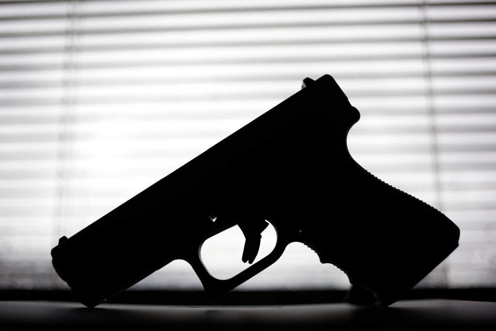 A Glock 19 9mm handgun is displayed for a photo in the office of Mad River School District Superintendent Chad Wyen in Dayton, Ohio.