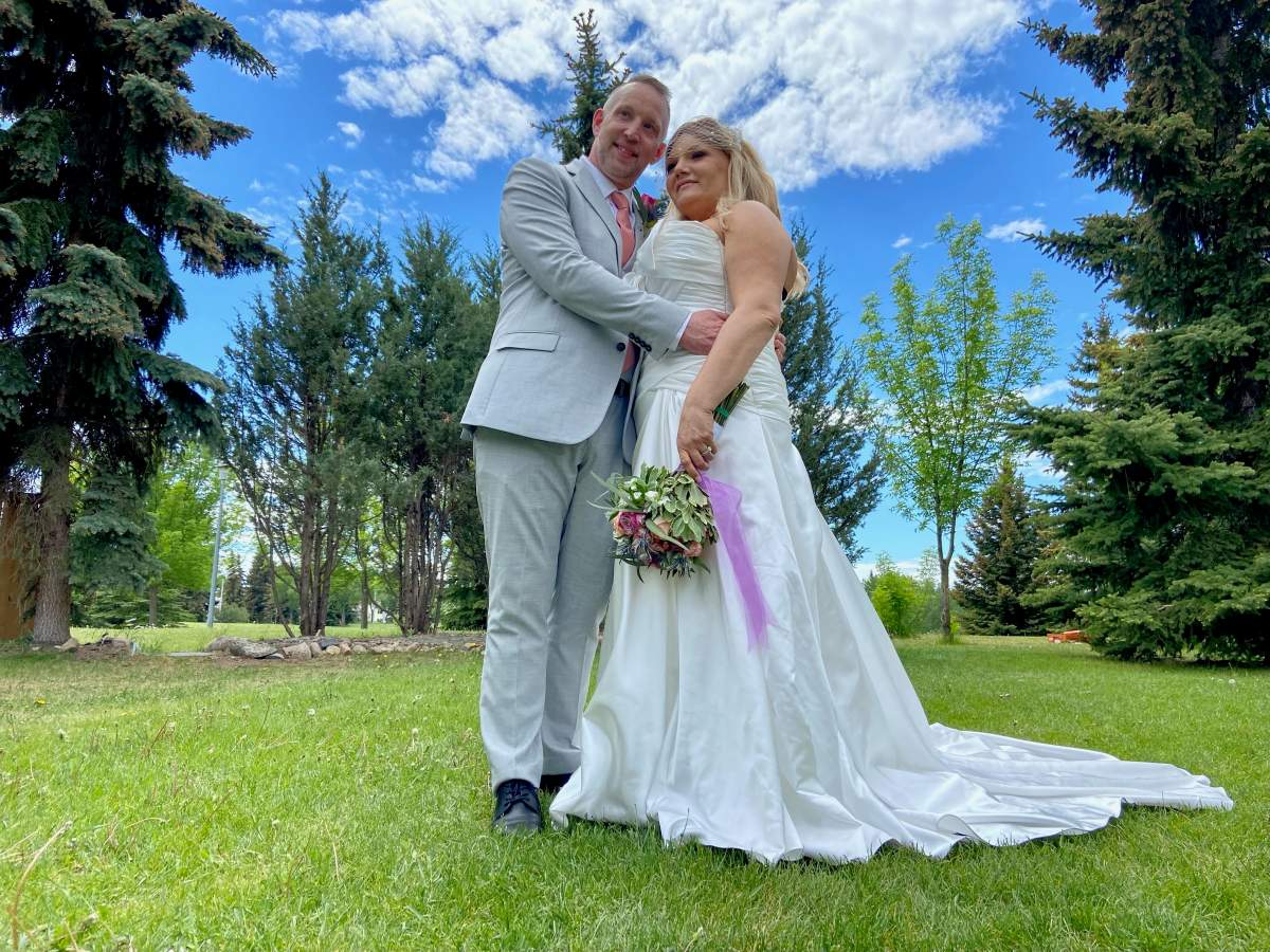 Stasha and Jason Storey pose for a wedding photo