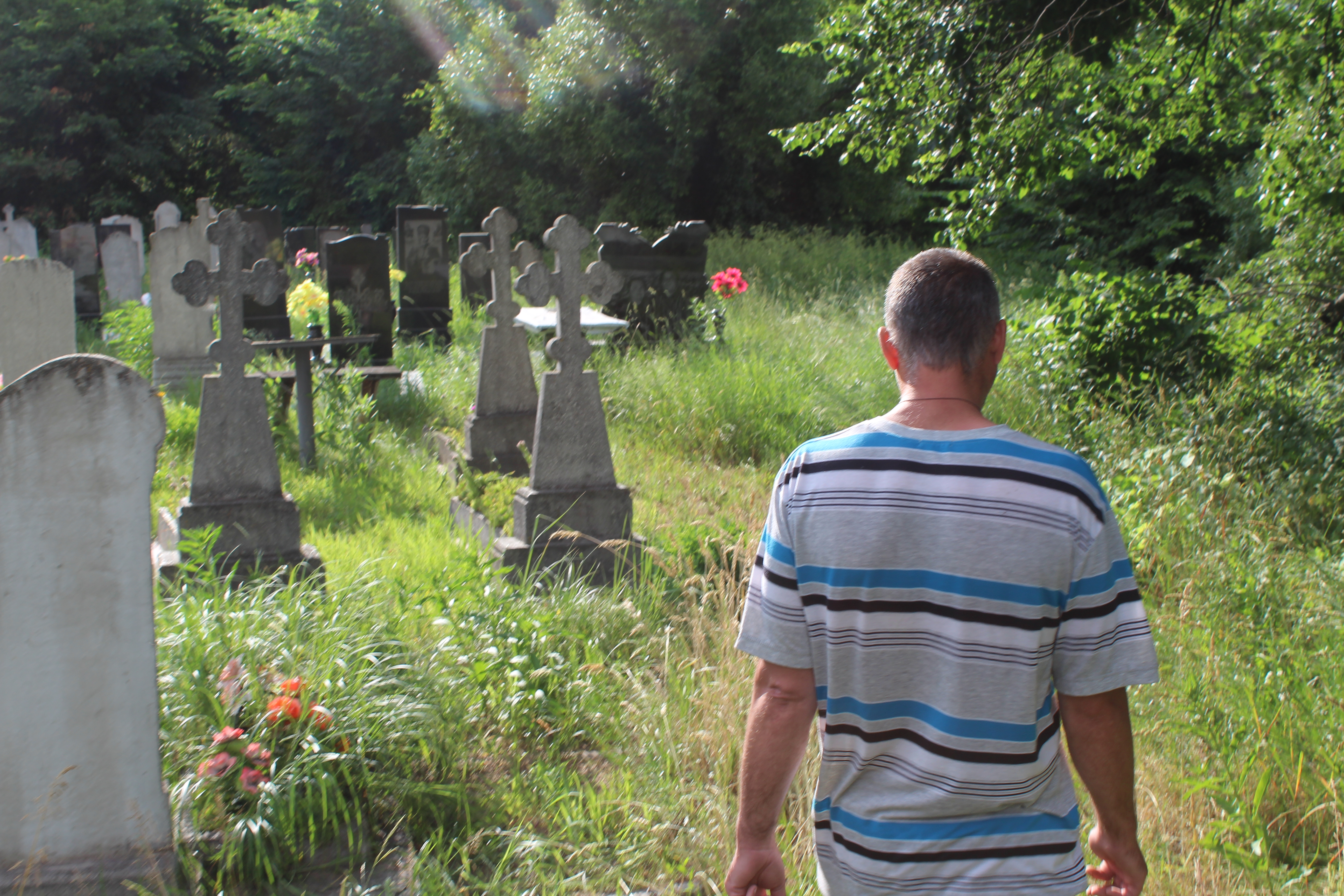 Andrii Horbyk visits his daughter’s grave on June 21, 2022.