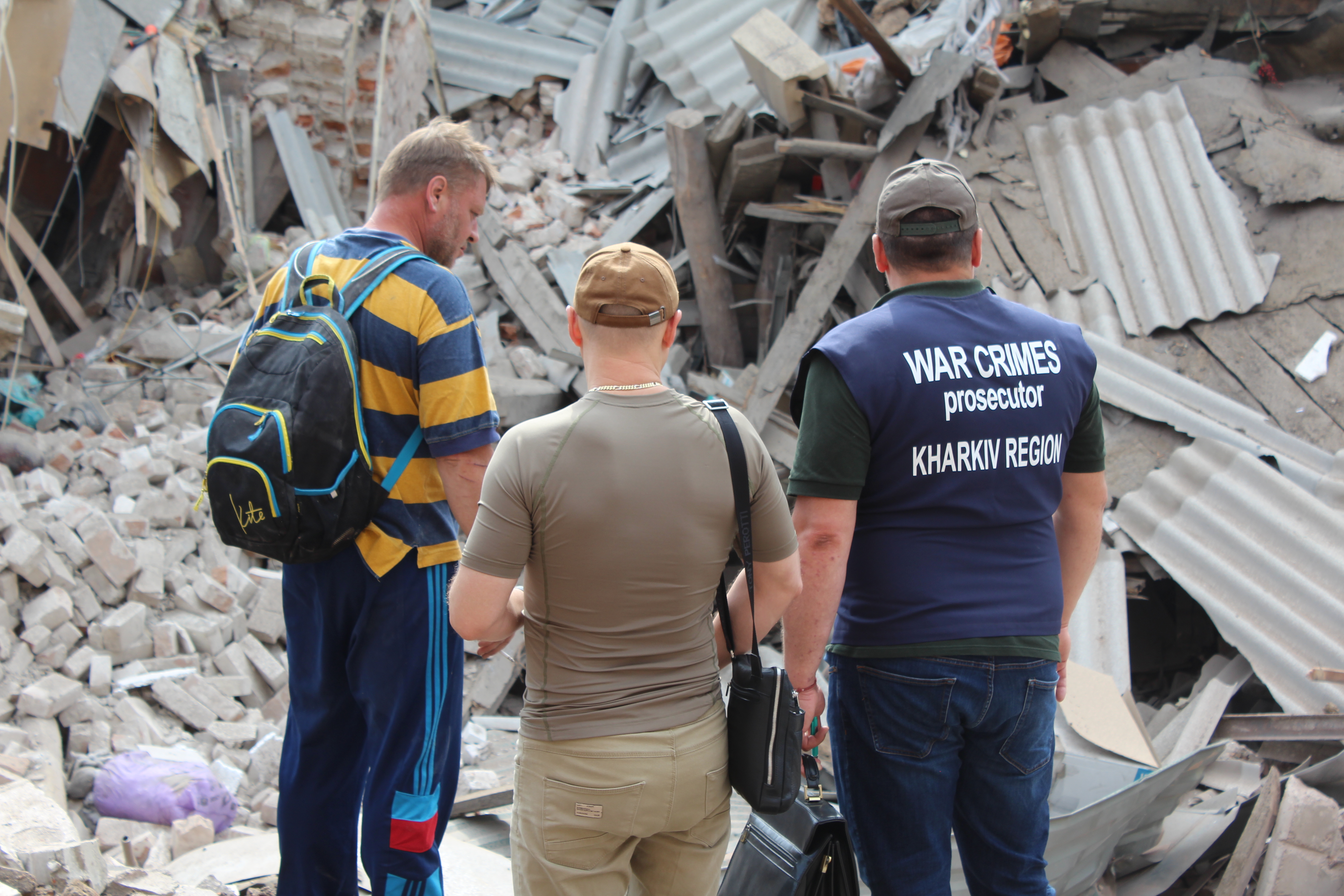 Kharkiv war crimes prosecutors, seen here at the scene of a Russian missile attack in Kharkiv city, have been overwhelmed by the Russian onslought.