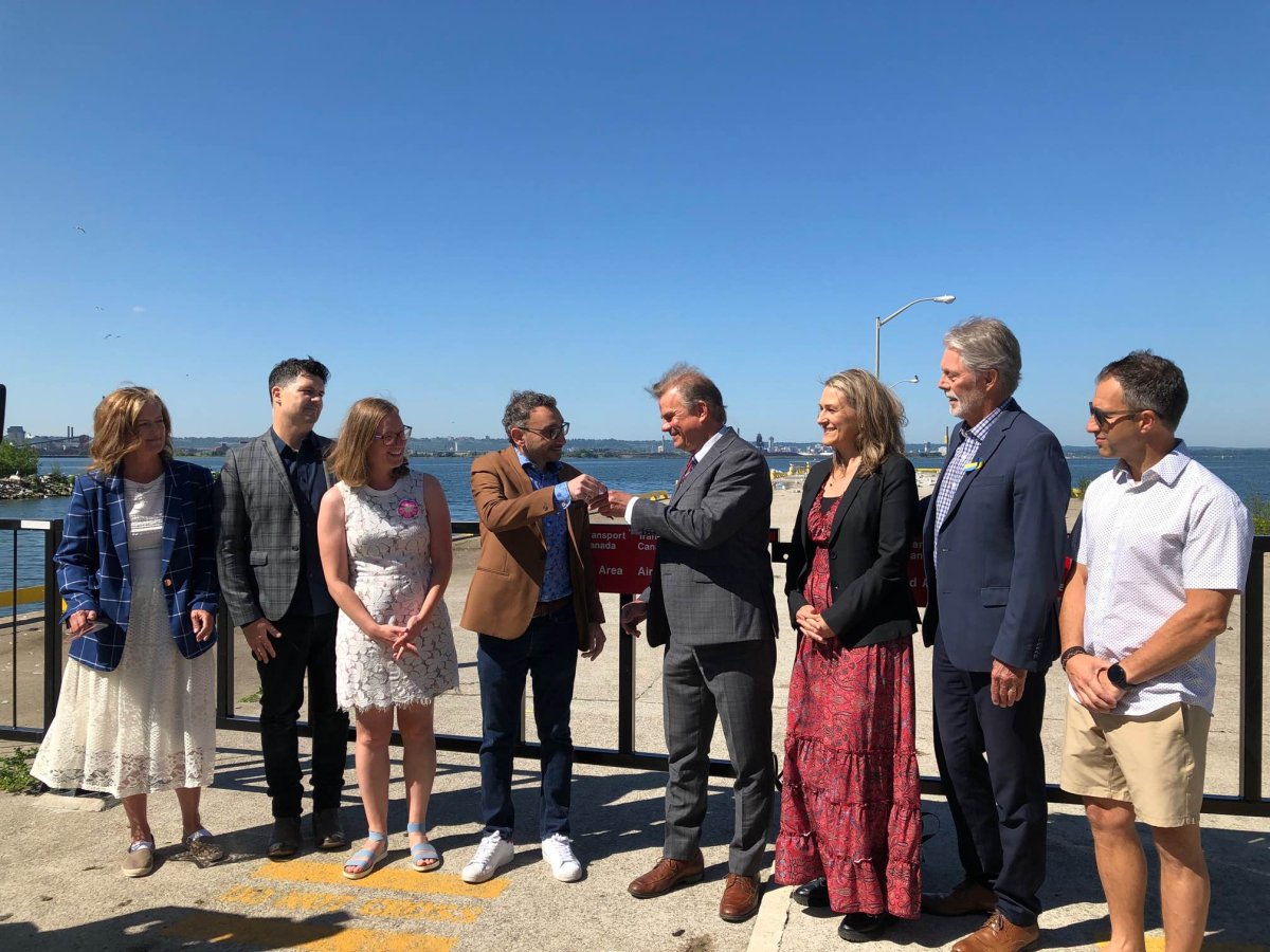 The Minister of Transport, Omar Alghabra, the Minister of Families, Children and Social Development, Karina Gould, the Member of Parliament for Hamilton East–Stoney Creek, Chad Collins, and the President and CEO of the Hamilton-Oshawa Port Authority, Ian Hamilton, at an announcement on the future of the Burlington Canal Piers.  