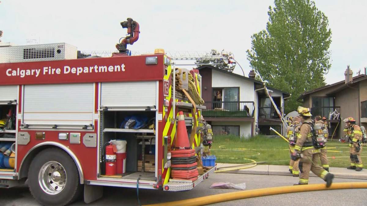 Calgary Fire Department puts out a house fire in Bowness on June 7, 2022.