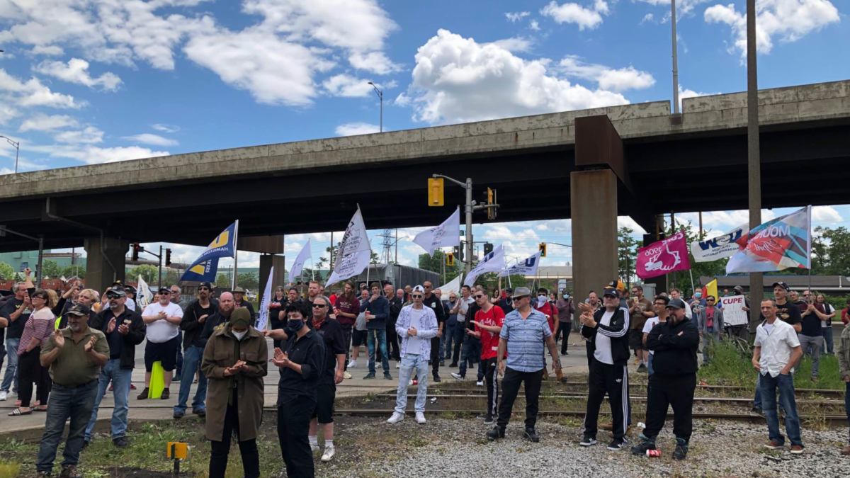 Union representatives and residents, who say they are outraged about workers dying on the job at National Steel Car, demonstrated in front of the Hamilton railcar manufacturer on June 9, 2022.