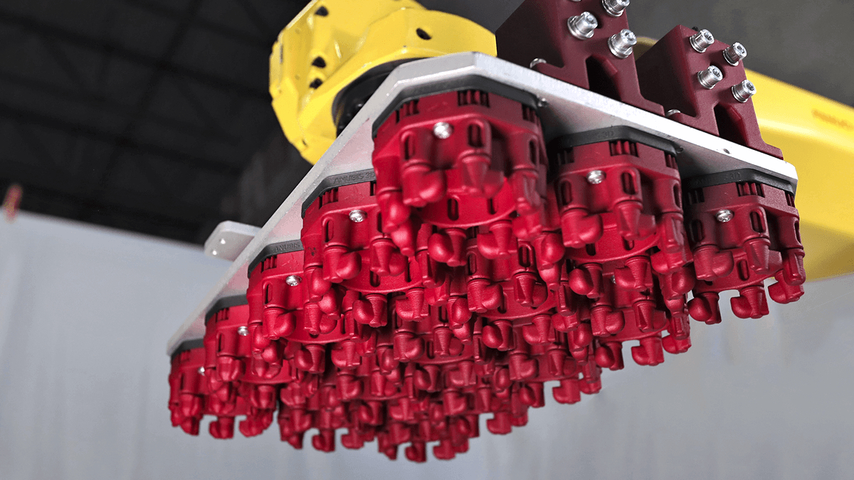 Each of the red plastic octagon-shaped components in this photo are printed by Anubis 3D, and showcase the ability of 3D printers to manufacture multiple interconnected, moving parts simultaneously. All of the internal gears and shafts seen here are able to rotate right out of the machine.