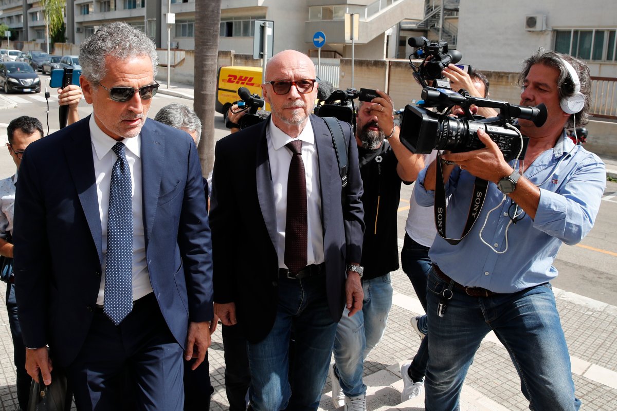 Canadian-born film director Paul Haggis, center, arrives with his lawyer Michele Laforgia at Brindisi law court in southern Italy, Wednesday, June 22, 2022, to be heard by prosecutors investigating a woman's allegations he had sex with her without her consent over the course of two days.