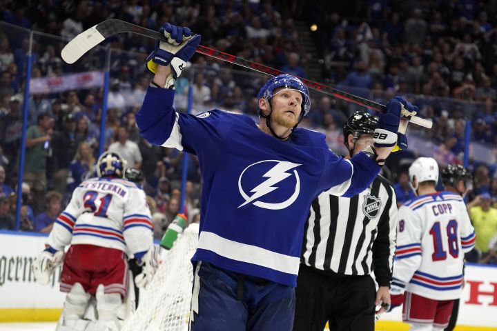 Tampa Bay Lightning right wing Corey Perry (10) reacts after getting called for a penalty during the second period in Game 3 of the NHL hockey Stanley Cup playoffs Eastern Conference finals against the New York Rangers Sunday, June 5, 2022, in Tampa, Fla.