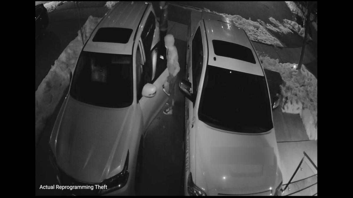 Security camera footage of two suspects executing an reprogramming vehicle theft at a residence in Halton Region in 2022.
