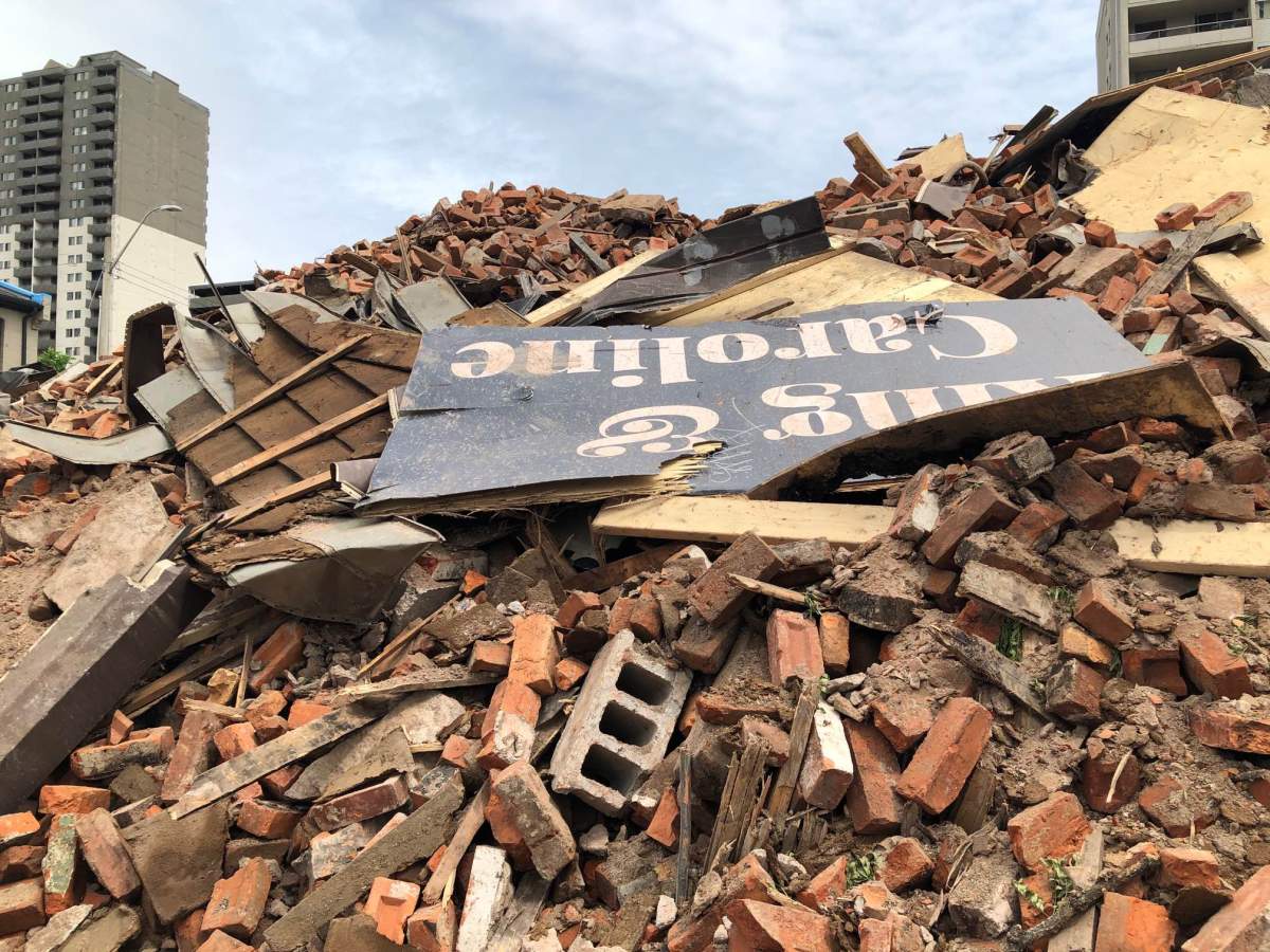 An arson charge has been laid by Hamilton Police, after flames destroyed a century-old downtown building on Saturday.