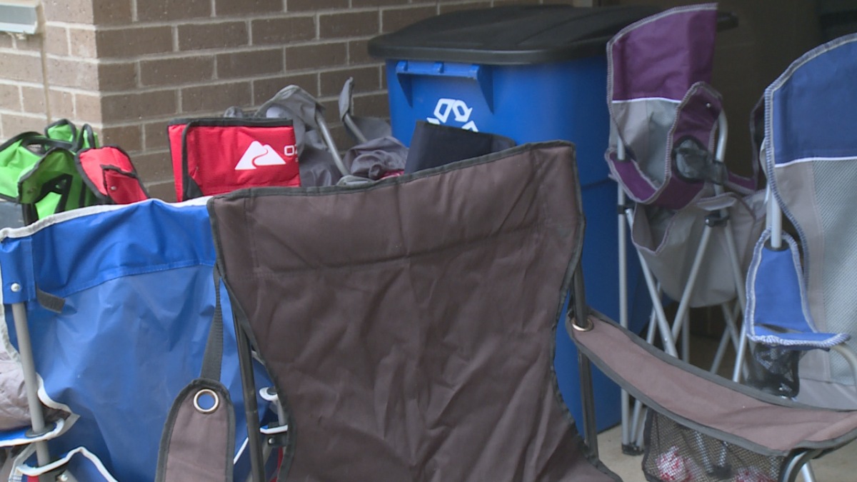 Many people brought camping chairs to sit in while they waited for the passport office to begin accepting people.