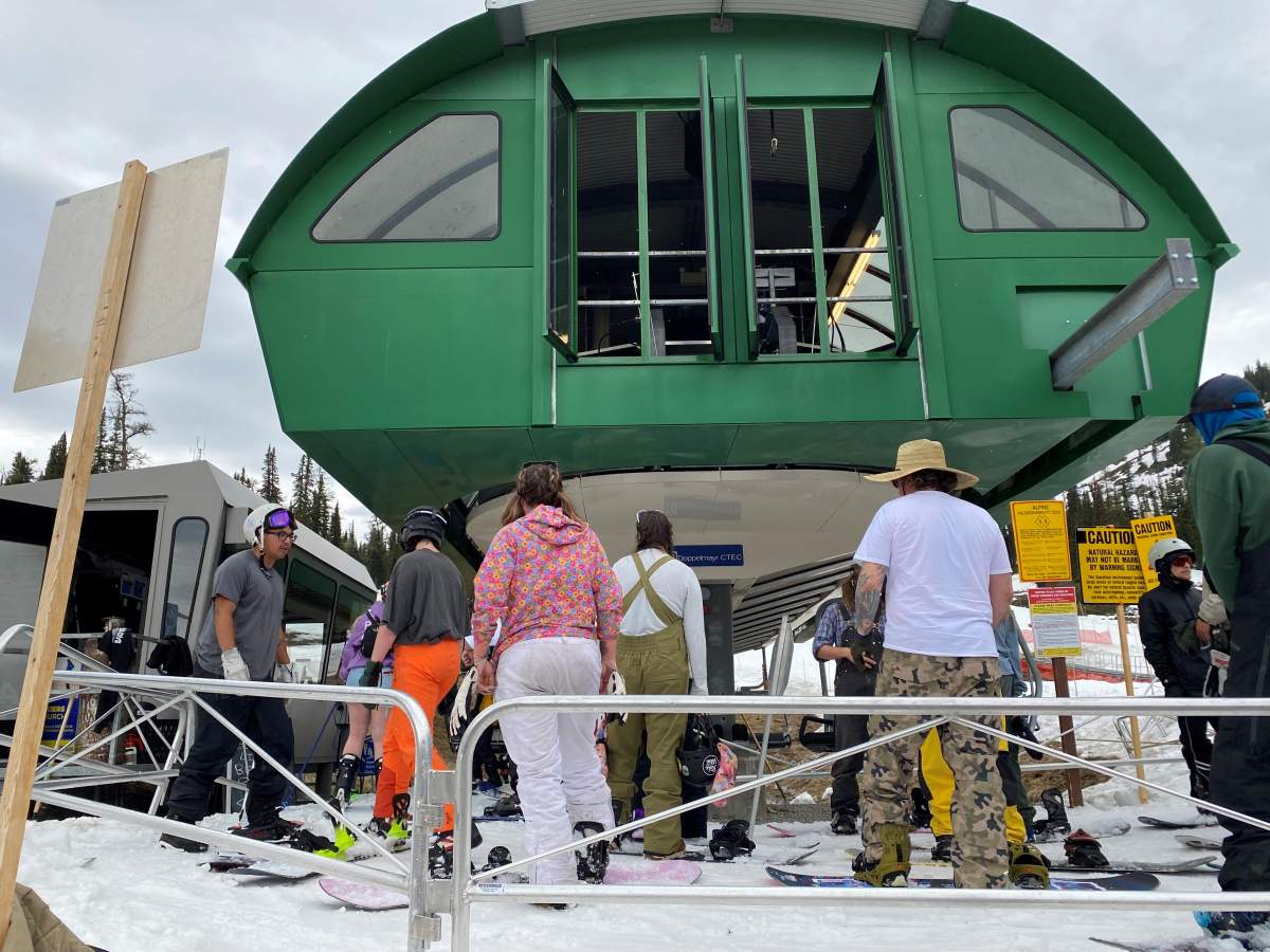 People skiing and snowboarding at Sunshine Village in Alberta's Banff National Park on Tuesday, June 28, 2022.