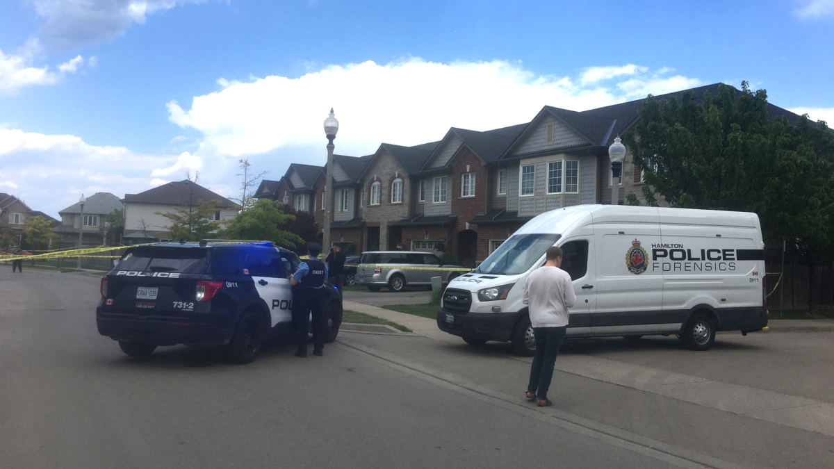 Hamilton Police on scene at a residential neighbourhood near Dartmouth Gate and North Service Road in Stoney Creek. Investigators say a person was shot at in broad daylight on June 3, 2022. 