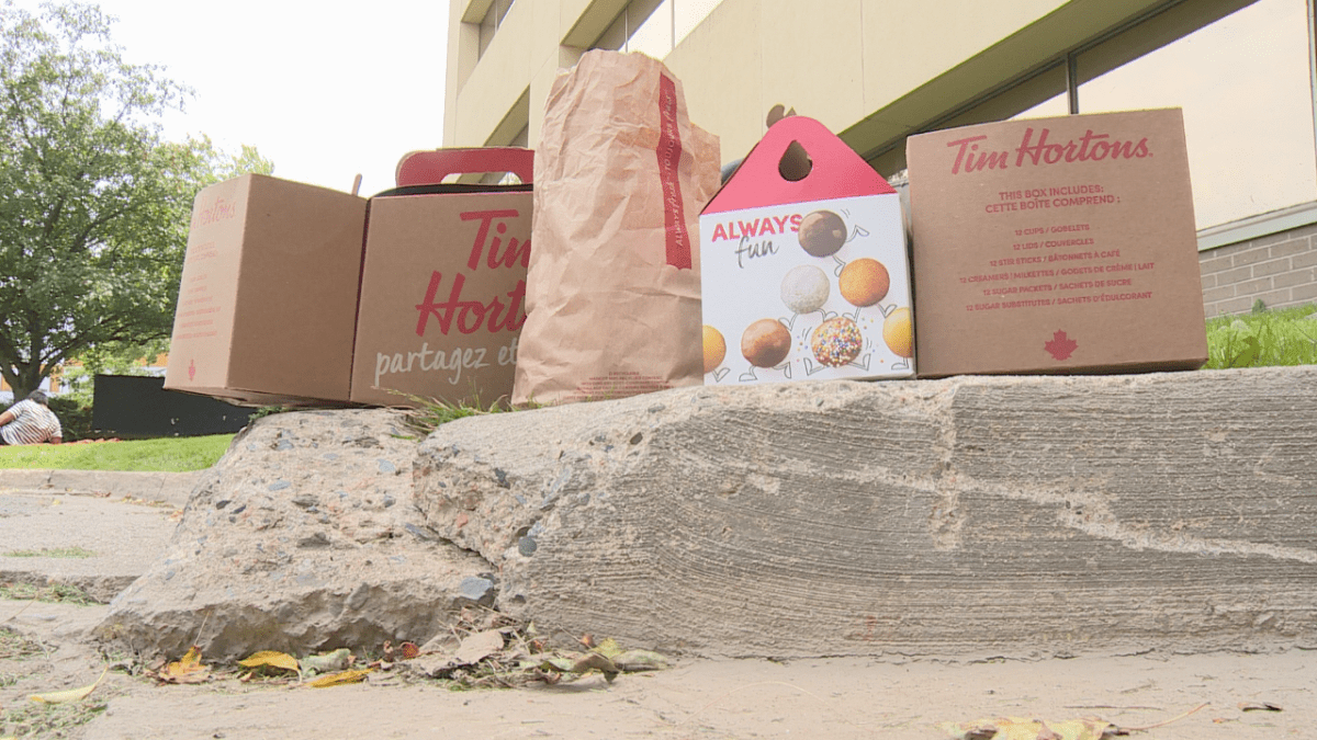 Coffee and donuts were on hand for people waiting in the sun on Monday.