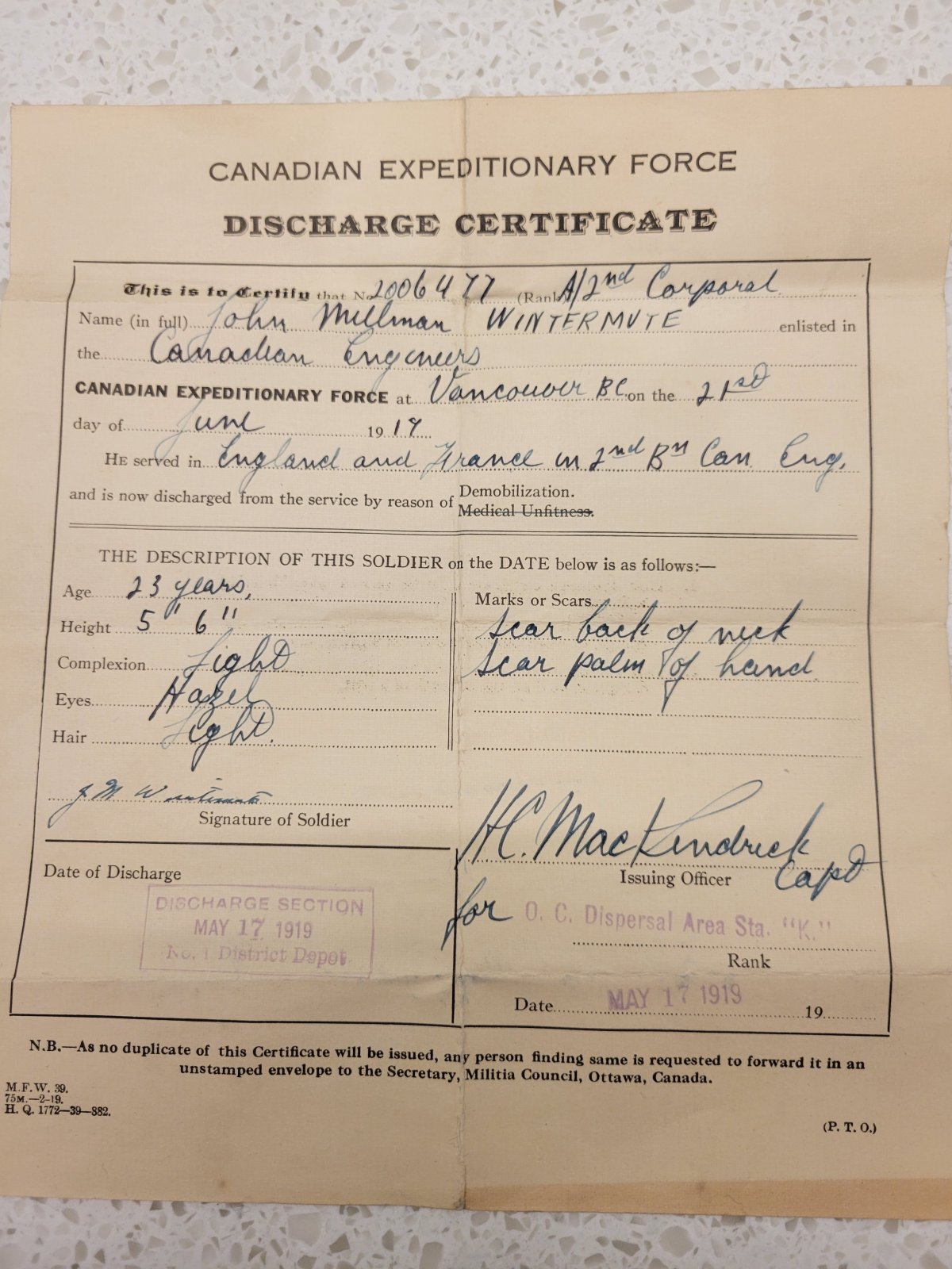 The Discharge Certificate of Corporal John Milliman Wintermute who served in both England and France and was discharged on May 17, 1919 .