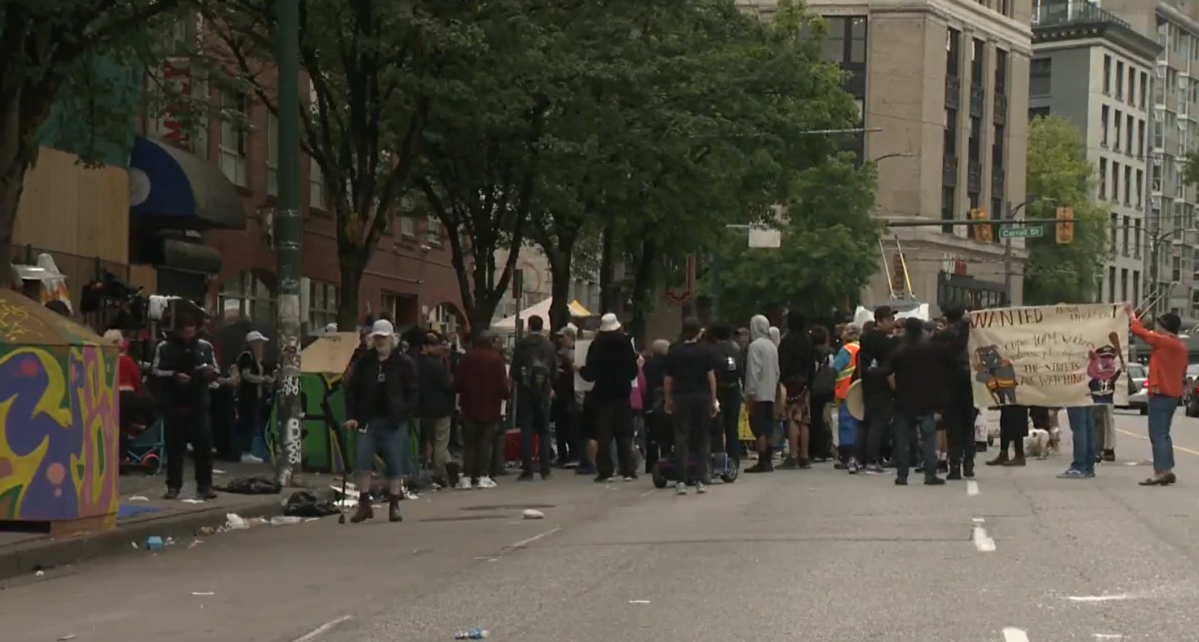 Demonstrators rally against the practice of "street sweeps" on Vancouver's Downtown Eastside. 