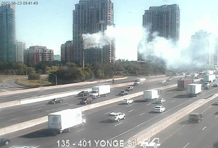 Smoke is seen coming from a communications tower at Yonge Street and Highway 401 on Thursday.