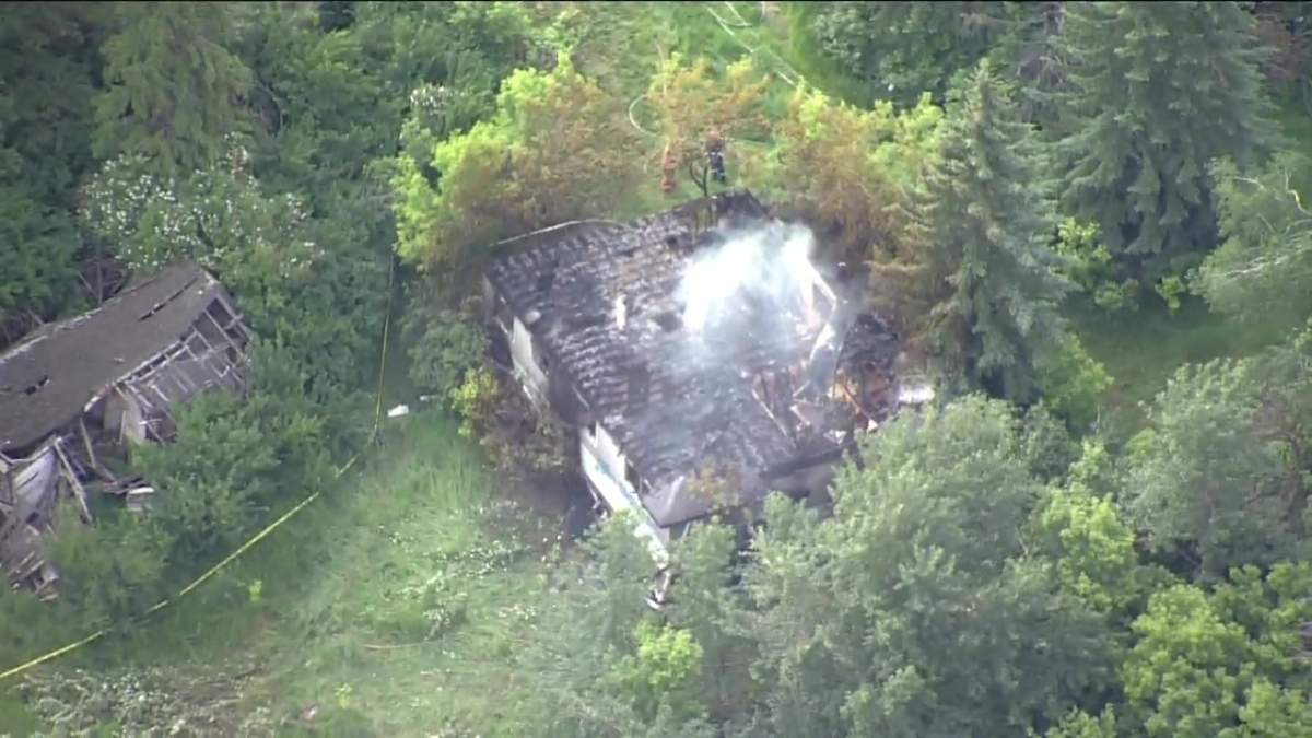 Strathcona County fire crews work to put out a fire at an abandoned building on June 28, 2022.