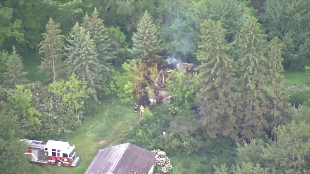 Strathcona County fire crews work to put out a fire at an abandoned building on June 28, 2022.