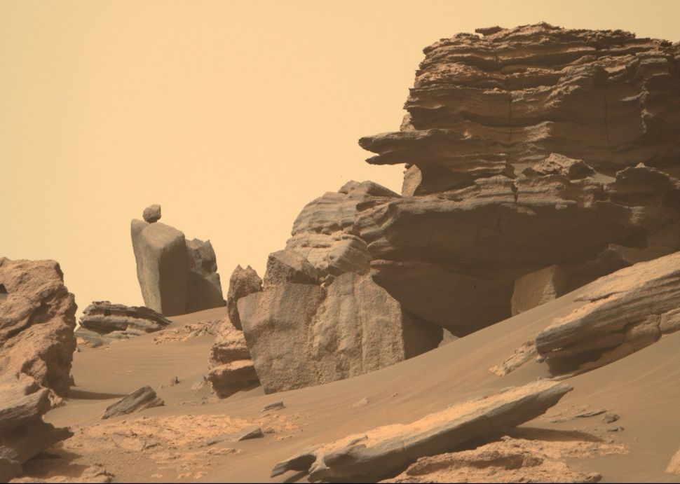 NASA's Mars rover Perseverance snapped this photo of a balancing boulder and snake-head rock on June 12, 2022, using its Mastcam-Z camera system.