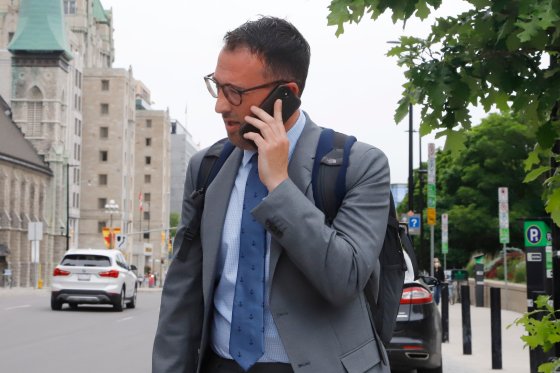 Federal bureaucrat Matthew Matchett is pictured outside the Ottawa courthouse.