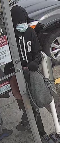 A suspects is seen on CCTV footage in an undated photo. Calgary police believe a pair of suspects are responsible for a string of pharmacy robberies from June 14 to 16, 2022.