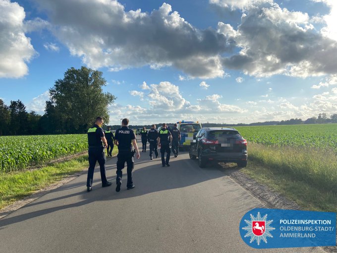 Oldenburg Police shared this photo of officers looking for the missing eight-year-old.