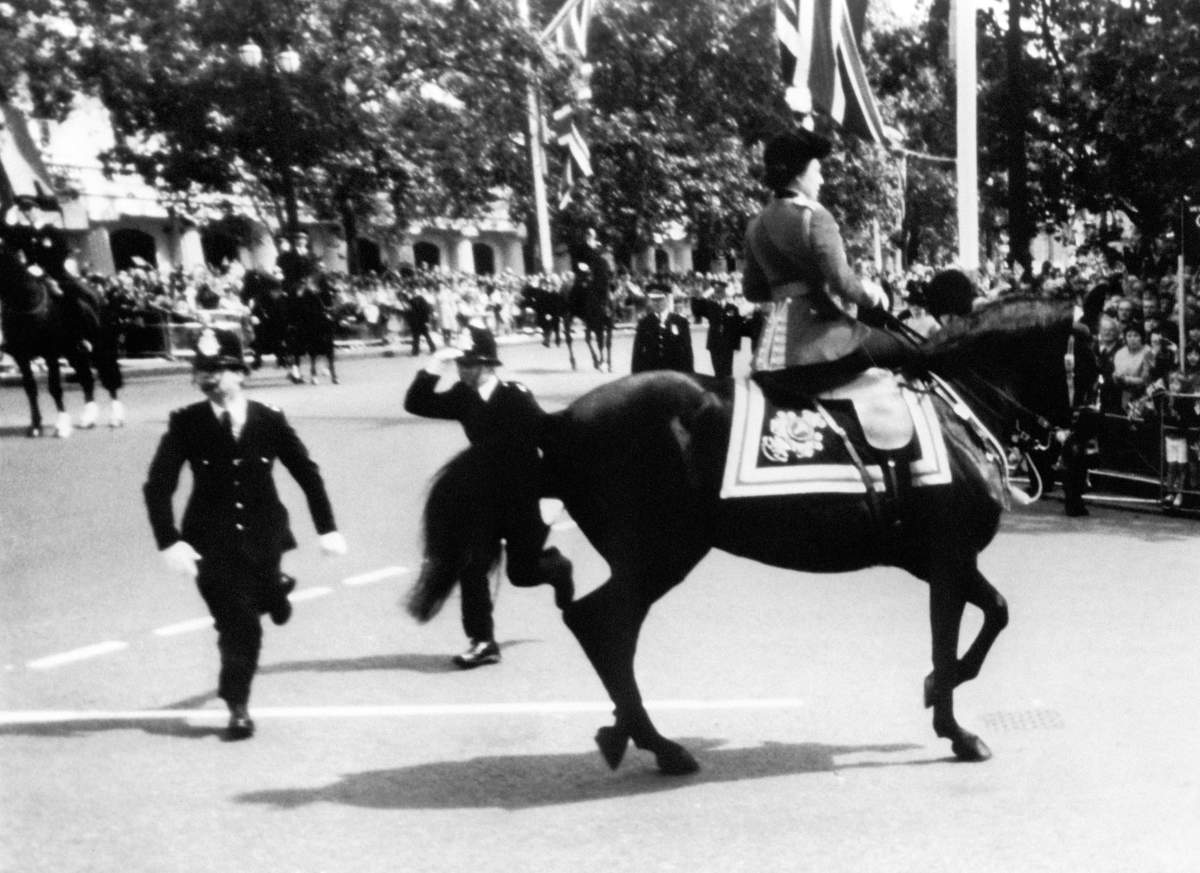 Queen Elizabeth II rides her horse, Burmese, during a 1981 incident.