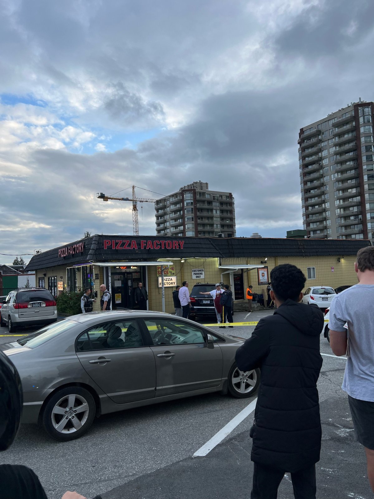 A large police presence could be seen outside the Pizza Factory restaurant near the Burquitlam Skytrain Station after a shooting Saturday night.