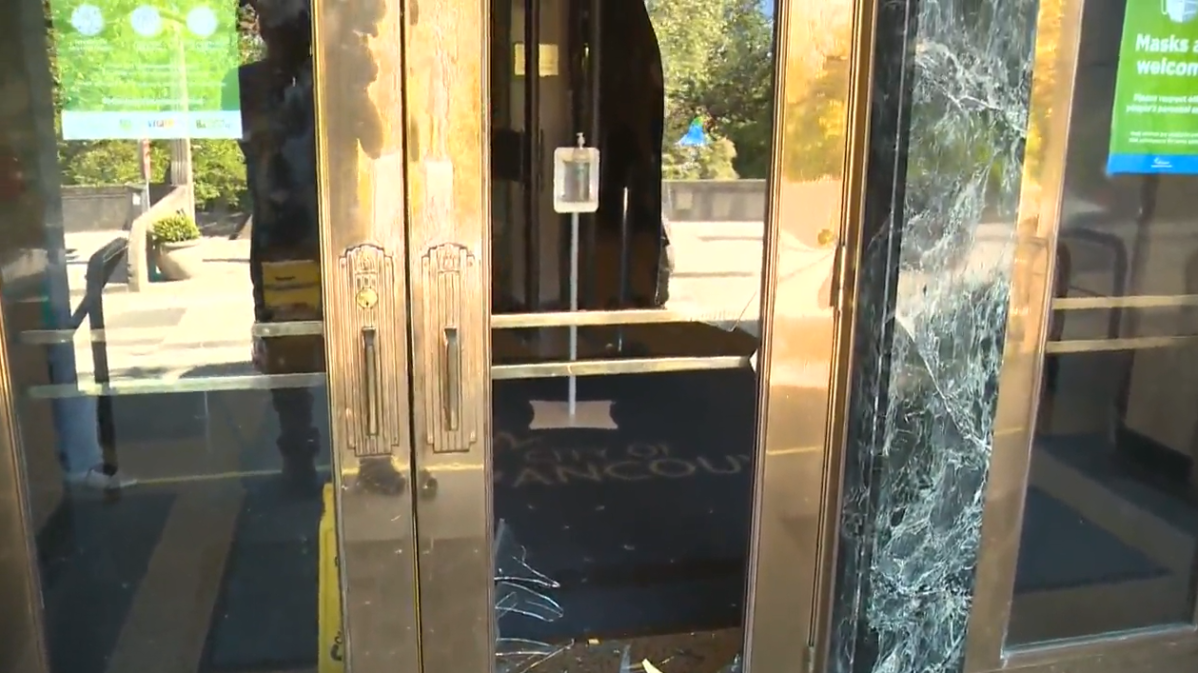 A smashed glass door at Vancouver City Hall on Wednesday. 