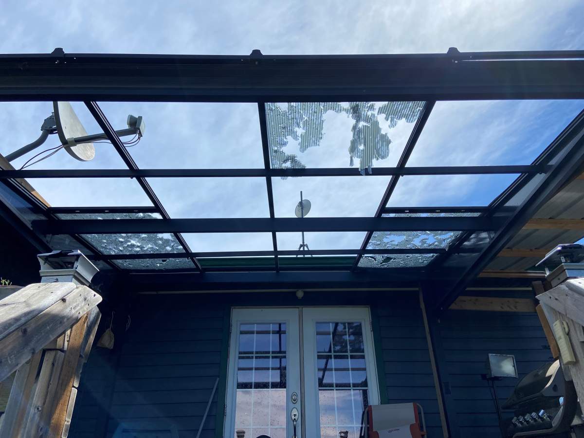 Their home’s awning was ripped apart by hail and rain.